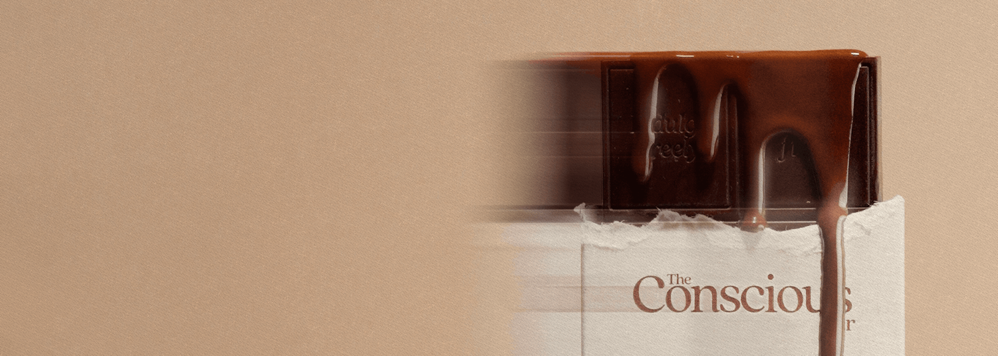 Chocolate bar with 'The Conscious' branding on a beige background