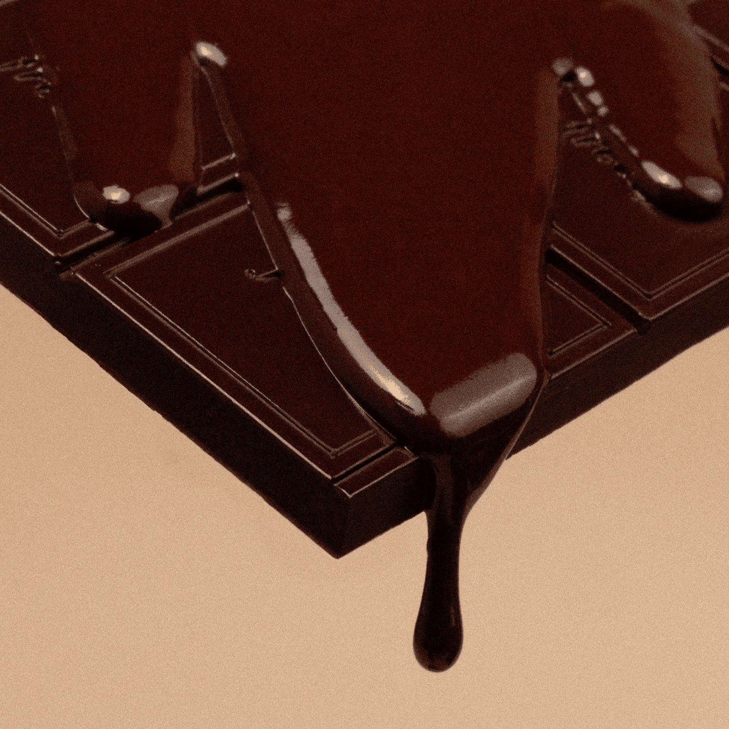Close-up of a chocolate bar with a piece being lifted, showing a rich brown color.